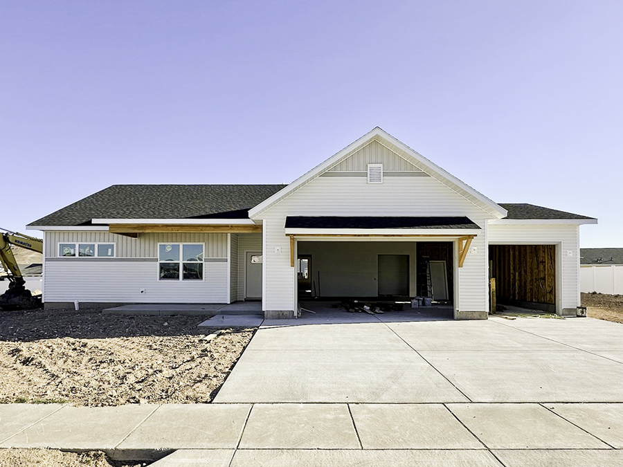 Photo of a charming, one-level farmhouse home with the words 